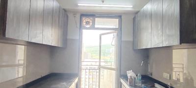 Kitchen Image of 950 Sq.ft 2 BHK Apartment / Flat for sale in JP Decks, Malad East Mumbai for Rs. 27000000