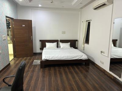 Bedroom Image of Comfort PG for Boys in Sector 26, Noida