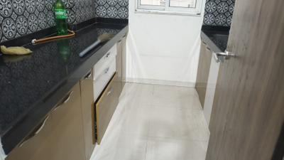 Kitchen Image of 610 Sq.ft 1 BHK Apartment / Flat for rent in Lodha Amara, Kolshet Thane for Rs. 28000