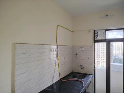 Kitchen Image of 750 Sq.ft 1 BHK Apartment / Flat for rent in Raunak Delight, Kasarvadavali Thane for Rs. 16503