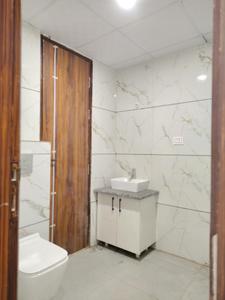 Common Bathroom Image of 1095 Sq.ft 2 BHK Apartment / Flat for sale in Devla Greater Noida for Rs. 4000100