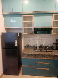 Kitchen Image of 860 Sq.ft 2 BHK Apartment / Flat for rent in Migsun Twiinz, Eta II Greater Noida for Rs. 28000