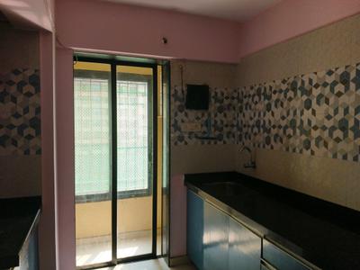 Kitchen Image of 950 Sq.ft 2 BHK Apartment / Flat for sale in Gajra Bhoomi Lawns, Shilphata Thane for Rs. 6100000