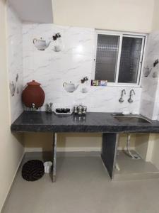 Kitchen Image of Radhika Raman Girls PG in Ghorpadi, Pune