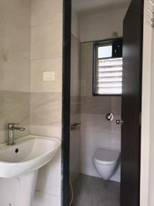 Common Bathroom One Image of 650 Sq.ft 1 BHK Apartment / Flat for sale in Shruti Apartment, Baner Pune for Rs. 6000000