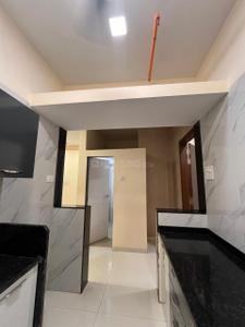Kitchen Image of 730 Sq.ft 1 BHK Apartment / Flat for sale in Mohan Precious Greens, Ambernath East Ambernath for Rs. 3500000