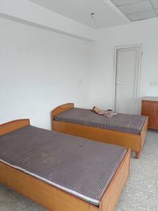 Bedroom Image of Palvi pg in Sector 26, Noida