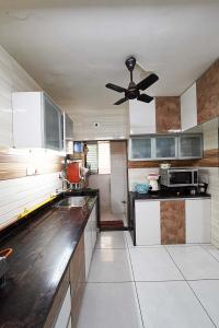 Kitchen Image of 936 Sq.ft 2 BHK Apartment / Flat for sale in Sarjan Tower, Memnagar Ahmedabad for Rs. 7700000