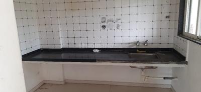 Kitchen Image of 670 Sq.ft 2 BHK Apartment / Flat for rent in Aakankssha Jubilation, Yewalewadi Pune for Rs. 17000