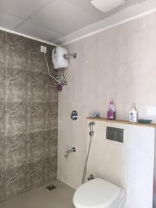 Common Bathroom One Image of 927 Sq.ft 2 BHK Apartment / Flat for sale in Lodha Palava Downtown, Palava Phase 2 Thane for Rs. 5500000