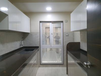 Kitchen Image of 704 Sq.ft 2 BHK Apartment / Flat for sale in SMGK Woods Platina Wing B Ebony Tower, Jogeshwari West Mumbai for Rs. 17500000
