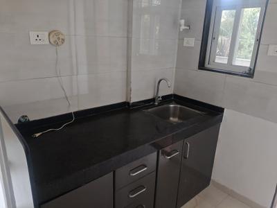 Kitchen Image of 660 Sq.ft 1 BHK Apartment / Flat for rent in Ajmera Exotica, Wagholi Pune for Rs. 15000