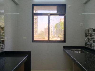 Kitchen Image of 710 Sq.ft 1 BHK Apartment / Flat for sale in Tharwani Vedant Millenia Happiness, Titwala Thane for Rs. 2600000