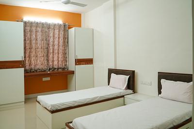 Bedroom Image of Radhesh PG for Boys in Satellite, Ahmedabad