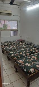 Bedroom Image of Yash pg in Ambawadi, Ahmedabad