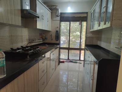 Kitchen Image of 900 Sq.ft 2 BHK Apartment / Flat for rent in Sudarshan Sky Garden, Kasarvadavali Thane for Rs. 38000