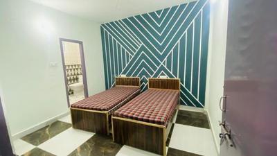 Bedroom Image of raj pg in Sector 22, Noida