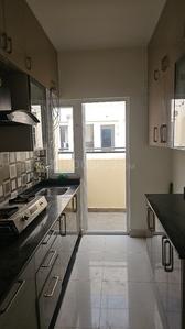 Kitchen Image of 850 Sq.ft 2 BHK Apartment / Flat for rent in Provident Park Square, Talaghattapura Bengaluru for Rs. 28000