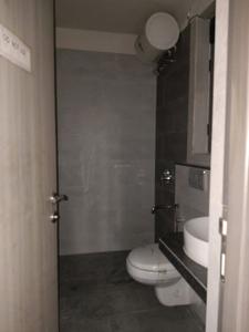 Common Bathroom One Image of 820 Sq.ft 2 BHK Apartment / Flat for sale in Rajesh White City, Kandivali East Mumbai for Rs. 22000000