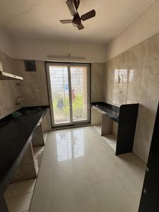 Kitchen Image of 750 Sq.ft 1 BHK Apartment / Flat for rent in Arihant Aarohi, Shilgaon Thane for Rs. 15000