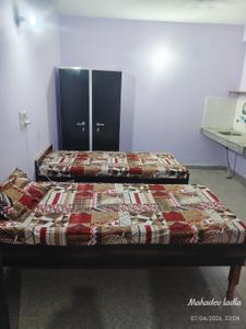 Bedroom Image of OM Residence in Dostpur Mangroli Khadar, Noida