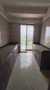 Kitchen Image of 710 Sq.ft 1 BHK Apartment / Flat for sale in Tharwani Vedant Millenia Happiness, Titwala Thane for Rs. 2600000