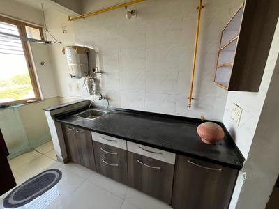 Kitchen Image of 963 Sq.ft 2 BHK Apartment / Flat for rent in Swagat Afford, Sargasan Gandhinagar for Rs. 29000