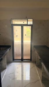 Kitchen Image of 776 Sq.ft 1 BHK Apartment / Flat for sale in Paradigm Pushpanjali Residency Phase III, Thane West Thane for Rs. 6390000