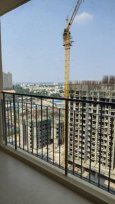 Balcony Image of 677 Sq.ft 1.5 BHK Apartment / Flat for rent in Bhartiya Nikoo Homes 4, Tirumanahalli Bengaluru for Rs. 40000