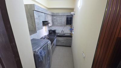 Kitchen Image of 585 Sq.ft 1 BHK Apartment / Flat for rent in Aditya Urban Homes Phase 1A, Bamheta Village Ghaziabad for Rs. 17000