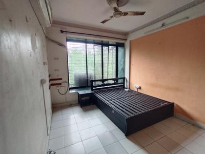 Bedroom Image of 650 Sq.ft 1 BHK Apartment / Flat for rent in Laxmi Narayan Complex, Kopar Khairane Navi Mumbai for Rs. 32000