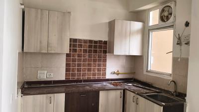 Kitchen Image of 900 Sq.ft 2 BHK Apartment / Flat for rent in Amrapali Zodiac, Sector 120 Noida for Rs. 23000