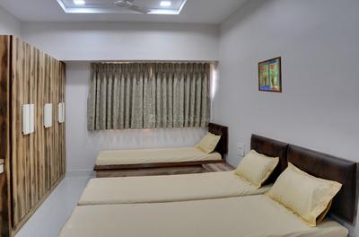 Bedroom Image of Radhakrishna Girls PG in Ambawadi, Ahmedabad