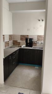 Kitchen Image of 900 Sq.ft 2.5 BHK Apartment / Flat for sale in Amrapali Enchante, Noida Extension Greater Noida for Rs. 7800000