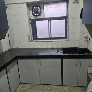 Kitchen Image of 950 Sq.ft 2 BHK Apartment / Flat for rent in Gokul Plaza, Kandivali East Mumbai for Rs. 45000
