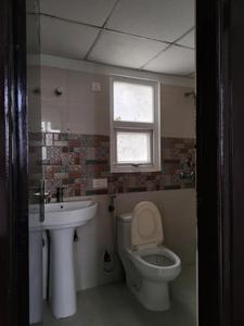 Common Bathroom Image of 1000 Sq.ft 2 BHK Apartment / Flat for sale in AFOWO Raksha Addela, Noida Extension Greater Noida for Rs. 8200000