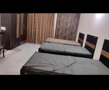 Bedroom Image of Apna Niwas pg  in Sector 62, Noida