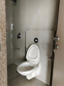 Common Bathroom Image of 555 Sq.ft 1 BHK Apartment / Flat for sale in Gurukrupa Marina Enclave by Gurukrupa Group, Malad West Mumbai for Rs. 12800000