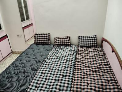 Bedroom Image of Kalyan PG - 2nd Floor, Parth Saarthi Apartment in Thaltej, Ahmedabad