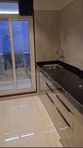 Kitchen Image of 450 Sq.ft 1 BHK Apartment / Flat for sale in Gajra Bhoomi Castle Phase I, Shilgaon Thane for Rs. 4200000