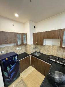 Kitchen Image of 702 Sq.ft 1 BHK Apartment / Flat for rent in Lodha Belmondo, Gahunje Pune for Rs. 35000