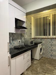 Kitchen Image of 1050 Sq.ft 2 BHK Apartment / Flat for rent in Sector 143 Noida for Rs. 50000