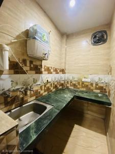 Kitchen Image of 360 Sq.ft 1 RK Builder Floor for rent in Dwarka Mor New Delhi for Rs. 13000