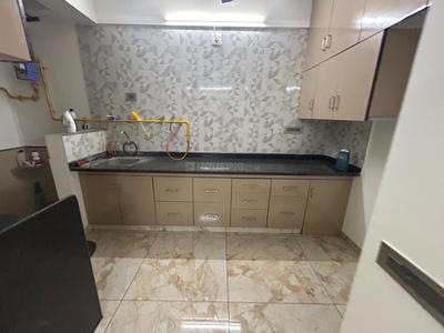 Kitchen Image of 1260 Sq.ft 2 BHK Apartment / Flat for rent in Swagat Queens Land, Sargasan Gandhinagar for Rs. 25000
