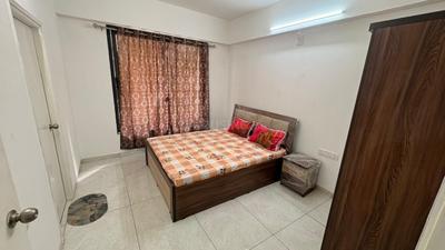 Bedroom Image of 910 Sq.ft 3 BHK Apartment / Flat for rent in Radhekrishna Shubh Green by Radhekrishna Group, Tragad Ahmedabad for Rs. 32000