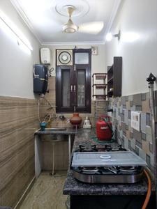 Kitchen Image of 650 Sq.ft 2 BHK Builder Floor for rent in Tilak Nagar New Delhi for Rs. 24999