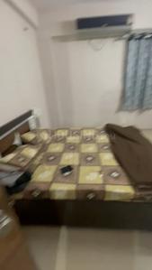 Bedroom Image of 990 Sq.ft 1 BHK Apartment / Flat for rent in LK Vrundavan Residency II, Sargasan Gandhinagar for Rs. 18500