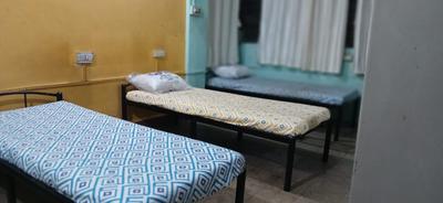 Bedroom Image of Ashwini p g in Koregaon Park, Pune