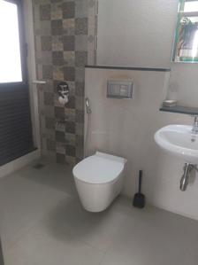 Common Bathroom Image of 750 Sq.ft 2 BHK Apartment / Flat for sale in Mahindra Roots, Kandivali East Mumbai for Rs. 18000000