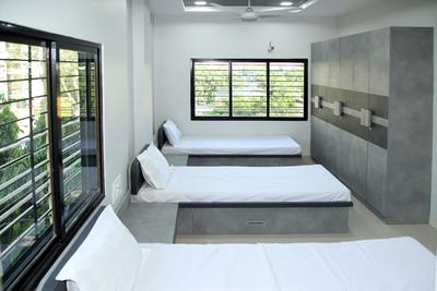 Bedroom Image of Radhesh PG for Boys in Satellite, Ahmedabad